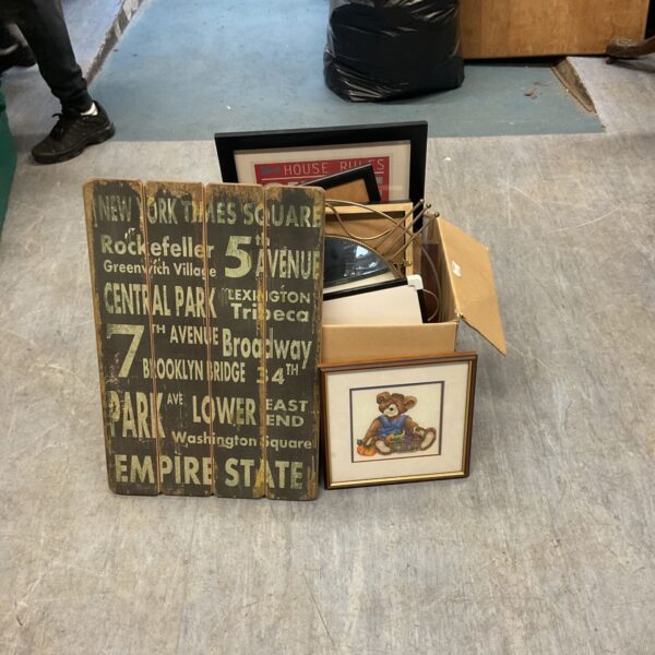 Box of mixed art prints and paintings for collectors.