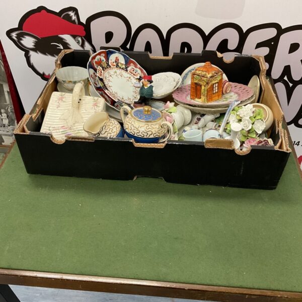Mixed lot of vintage china pieces with floral patterns.