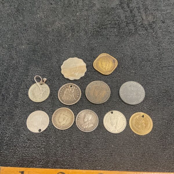 Mixed coin lot featuring silver and other vintage coins.