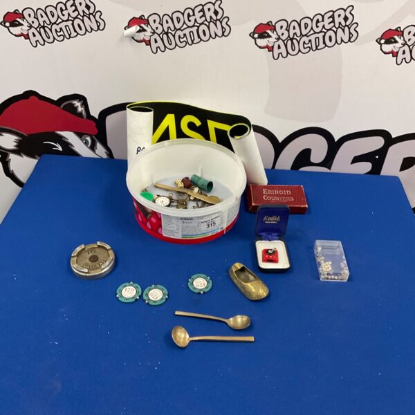 Mixed curios lot featuring vintage spoons and small collectibles.