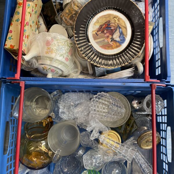Mixed lot of vintage china and crystal glassware on display.