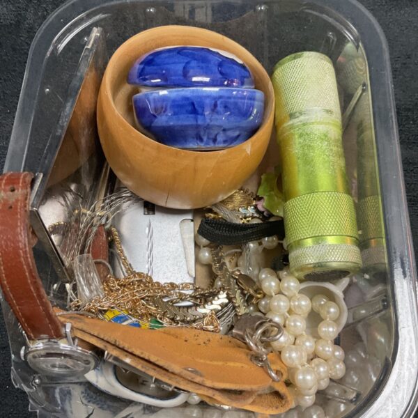 Tray of mixed lot jewellery and collectibles, including porcelain and a belt.