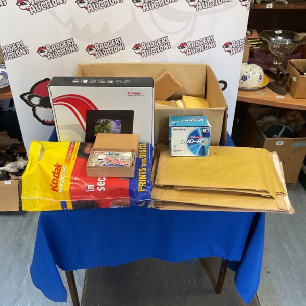 Mixed lot of stamps, DVDs, and a Toshiba digital photo frame.