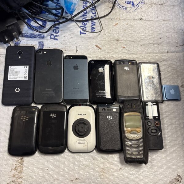 Mixed lot of vintage and modern mobile phones, including iPhones and Blackberrys.