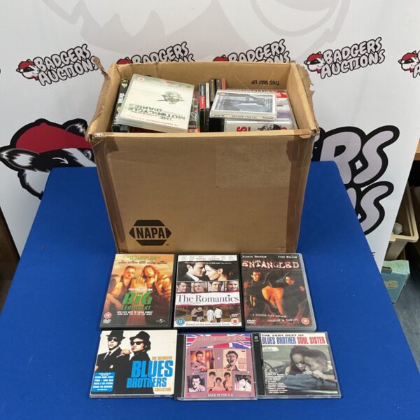 Mixed lot of music CDs and DVD movies for sale.