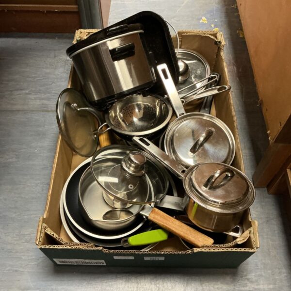 Mixed lot of stainless steel pots and pans for kitchen use.