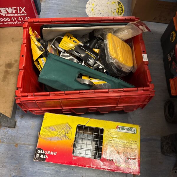 Mixed tool lot in a crate with paint rollers and a trap.