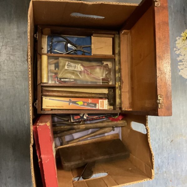 Mixed lot of vintage hand tools in a cardboard box.