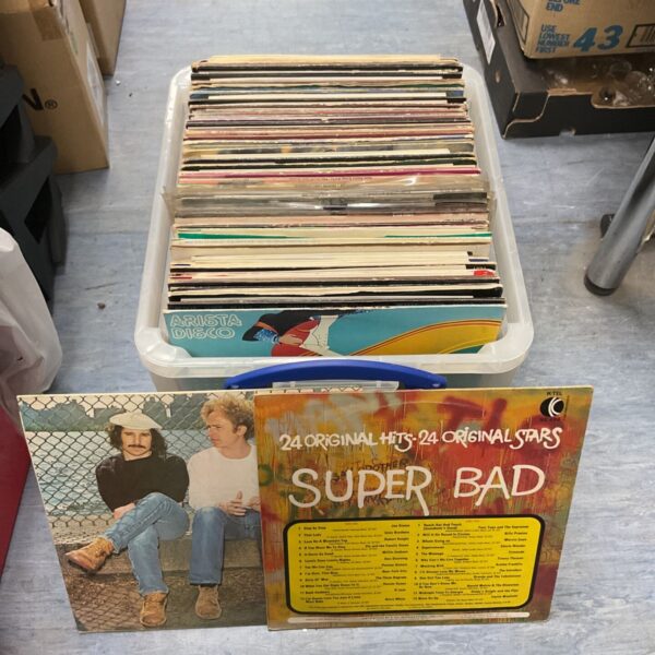Mixed lot of 12 inch vinyl records with a disco theme.