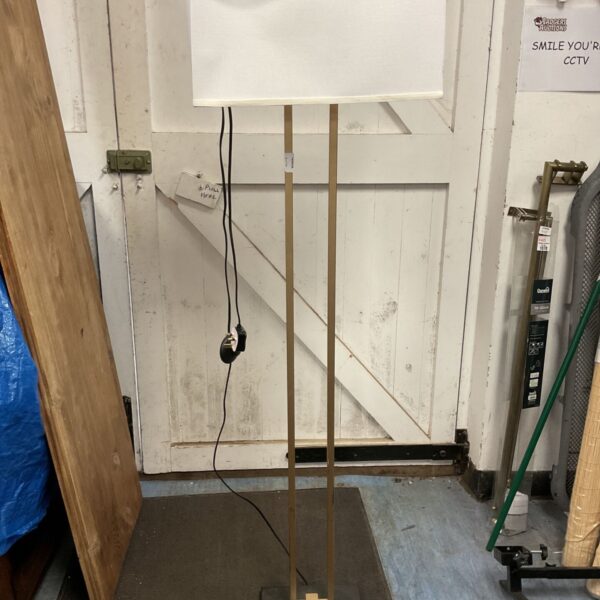 Modern standard lamp with a slight tear in the shade.