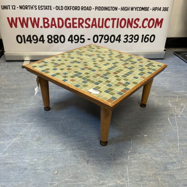 Vintage mosaic coffee table in Danish style with green and brown tiles.
