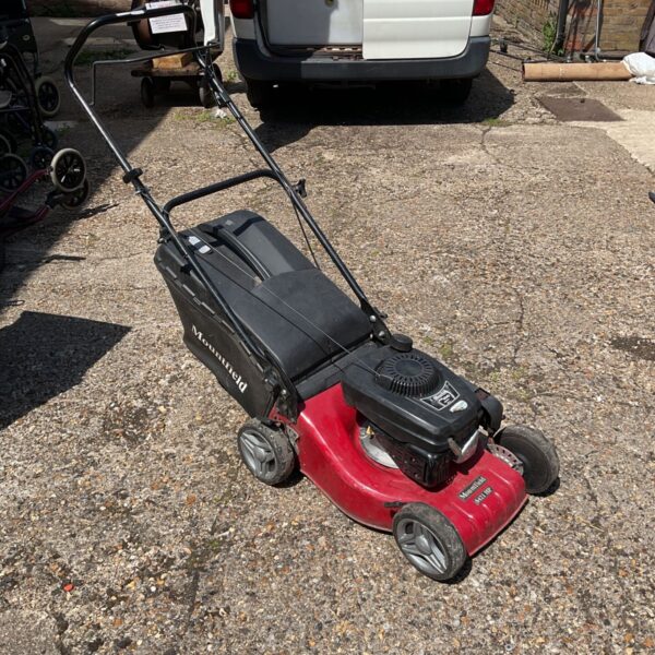 Mountfield S421HP petrol lawnmower in a garden setting.