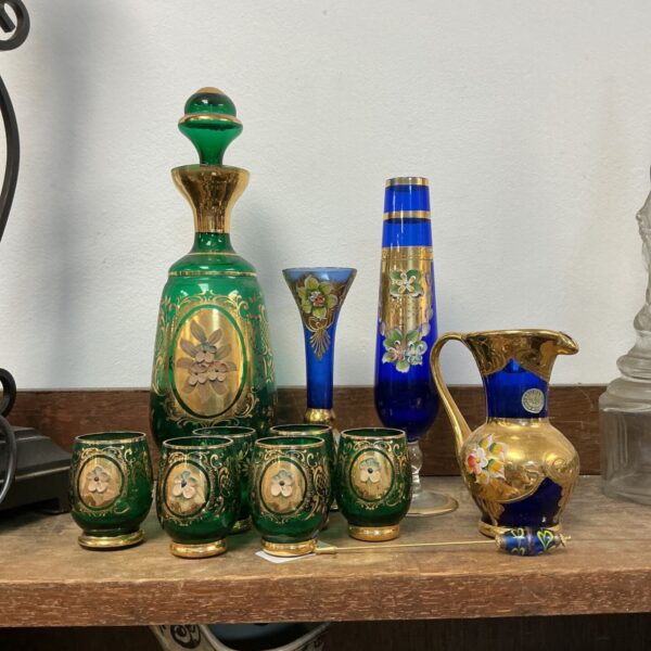 Vintage Murano Bohemian glass decanter set with gilded details.