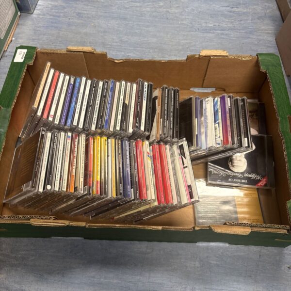Box of mixed music CDs for collectors and music enthusiasts.