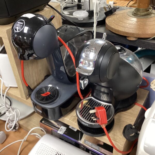 Two Nescafe Dolce Gusto coffee machines in a kitchen setting.
