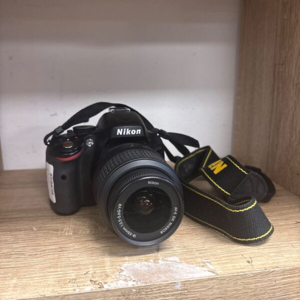 Nikon D5100 digital SLR camera with 18-55mm lens for photography.
