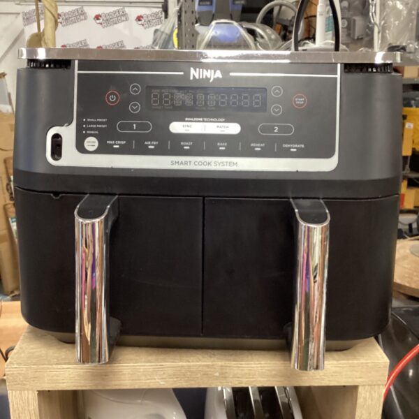 Ninja dual zone air fryer with digital display and dual baskets.