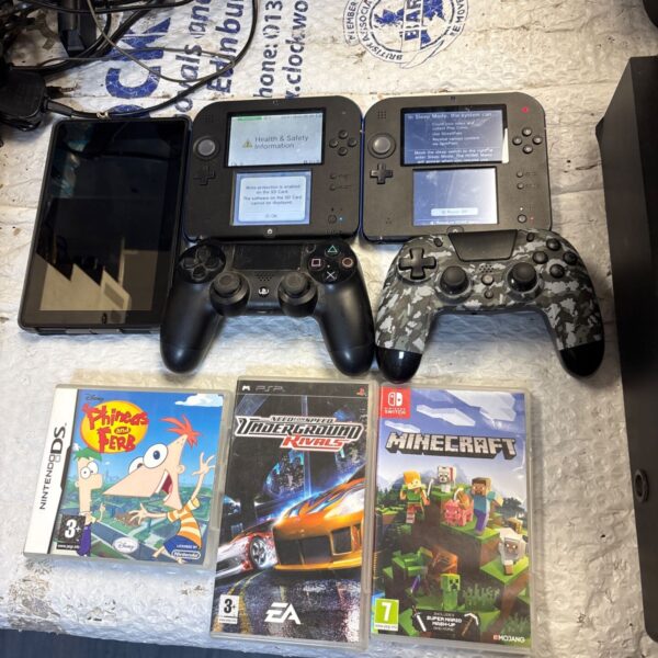 Nintendo 2DS console bundle with games displayed for auction.