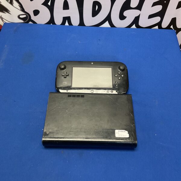 Nintendo Wii U console with gamepad controller for retro gaming.