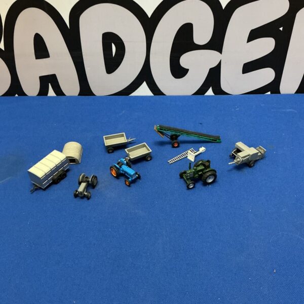 Oxford Diecast farm machinery set with tractors and implements.