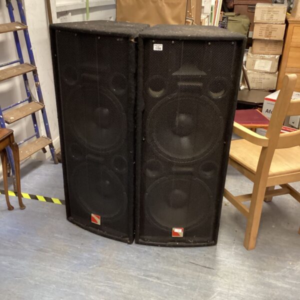 Large black PA speakers, intimidating design for sound reinforcement.