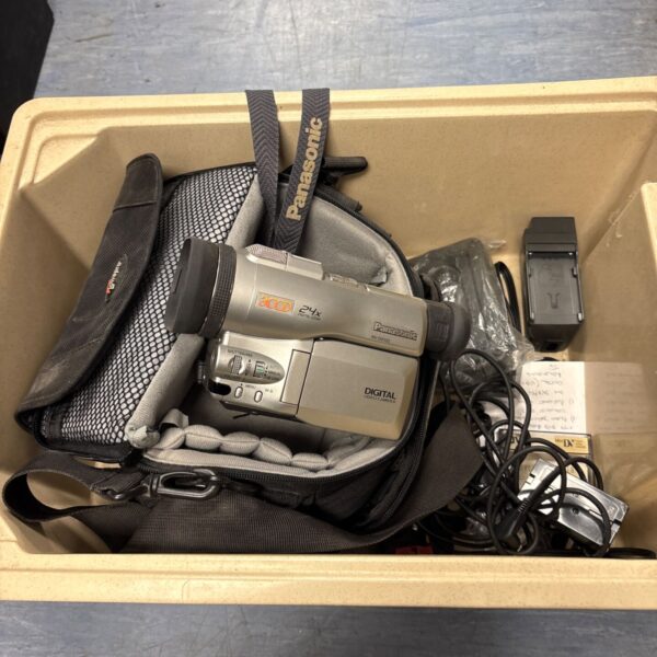 Panasonic DX100 digital video camera with accessories shown.