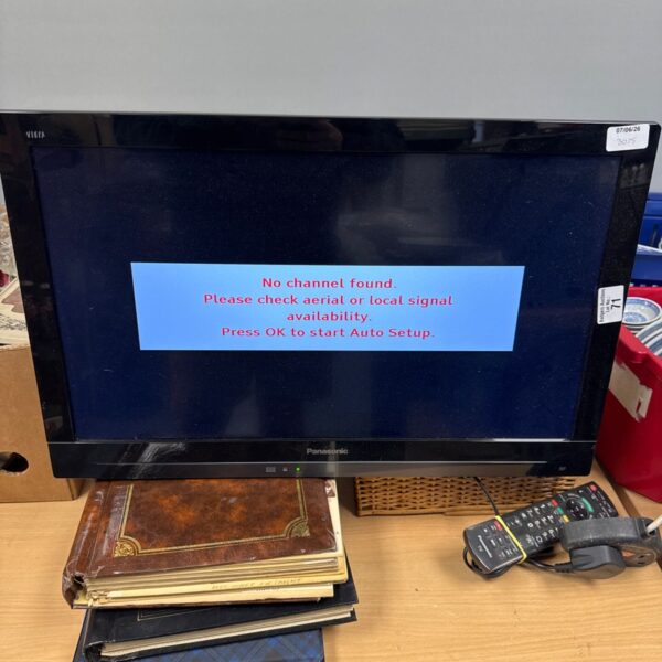 Panasonic Viera TX-L24E3B flatscreen TV with remote control.