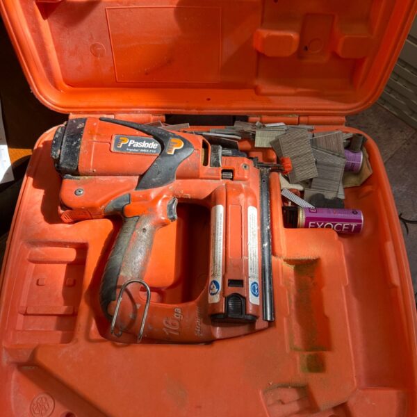 Paslode Impulse IM65 F16 cordless nail gun in open case.