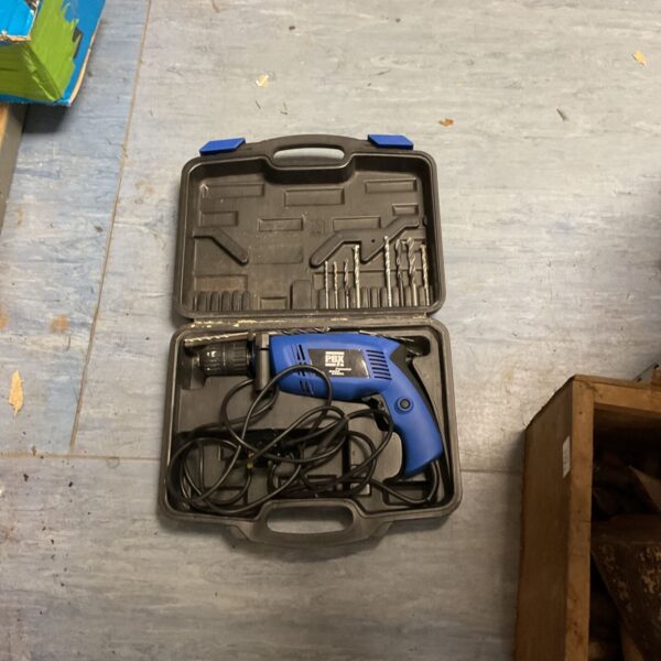 Pbx corded impact drill in a carrying case, showing wear.