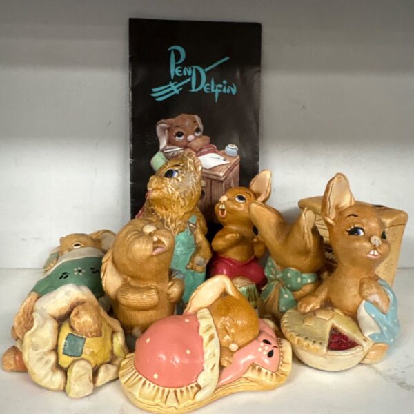 Vintage Pen Delfin figurines, a charming ceramic animal collection.