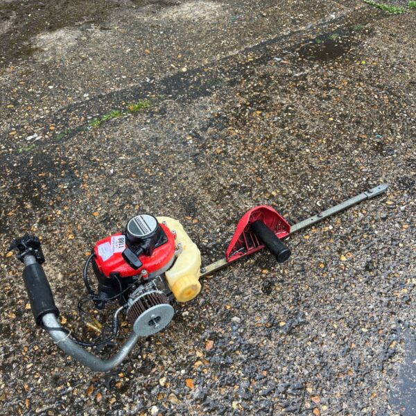 Used petrol garden multi-tool with long reach hedge trimmer attachment.