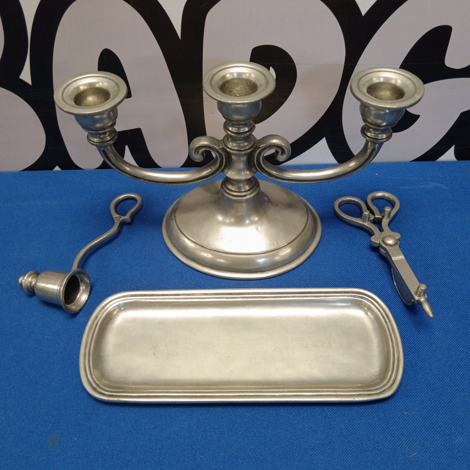 Vintage pewter candlestick set with tray and snuffers for home decor.