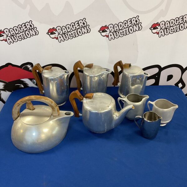 Vintage Picquot Ware tea and coffee set with silver-tone finish.