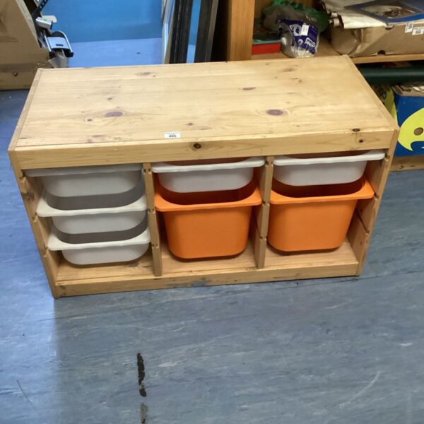 Rustic pine storage unit with nine removable plastic trays.