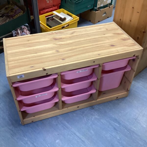 Wooden pine storage unit with multiple compartments for organisation.