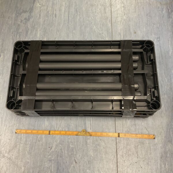 Black plastic shelving system for modular storage.