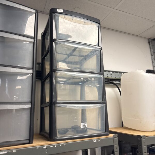 Clear plastic four-drawer storage cabinet for home organisation.