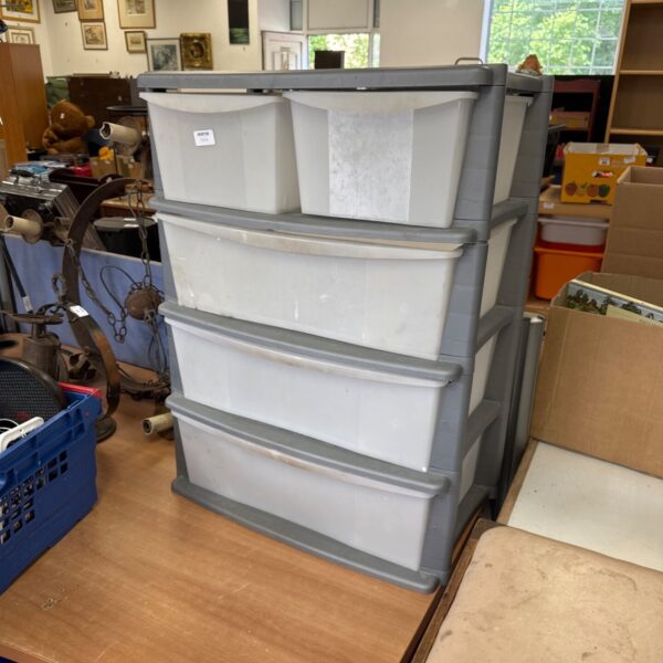 Grey plastic storage drawers unit for home organisation.