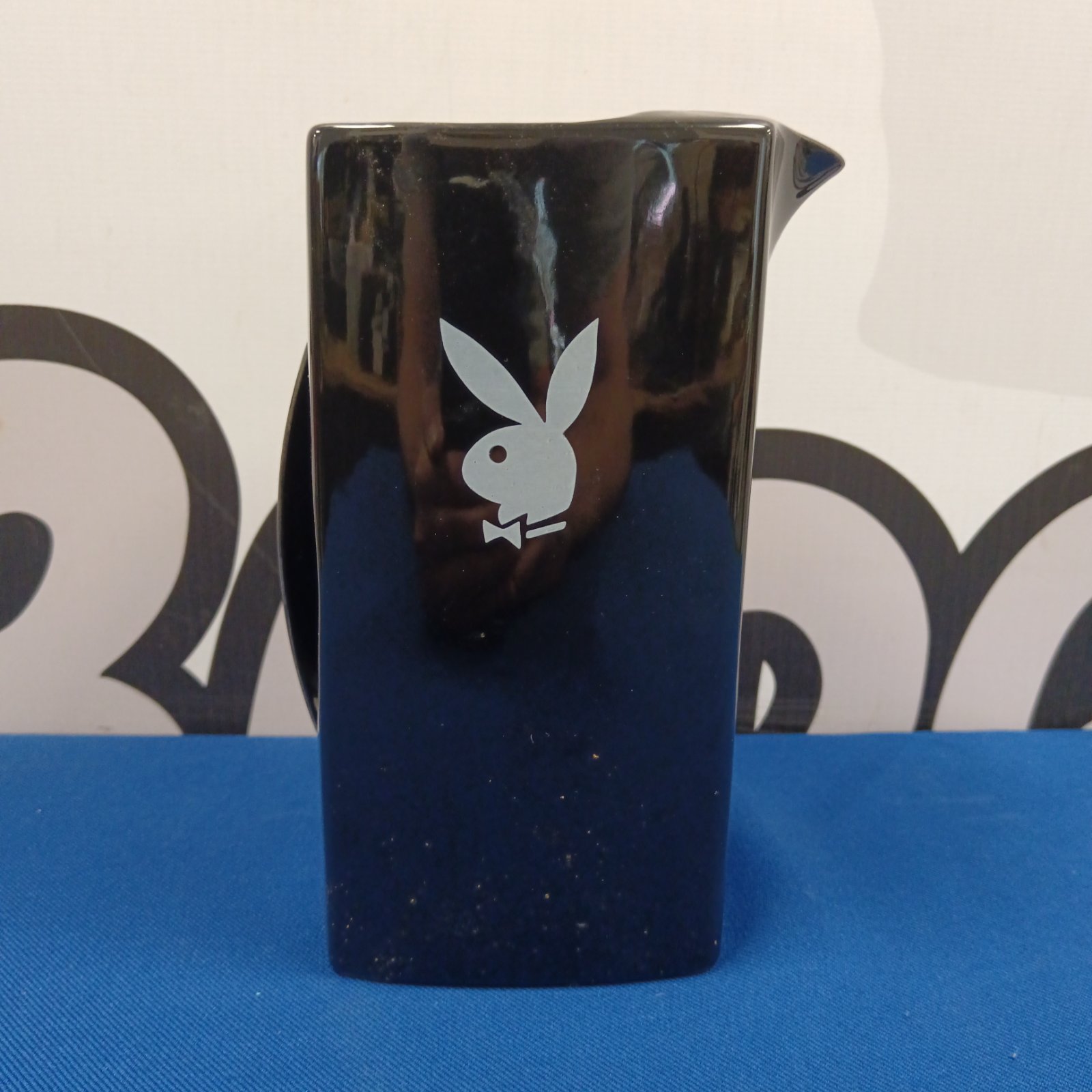Black glazed Playboy Dodo Designs ceramic jug with bunny logo.