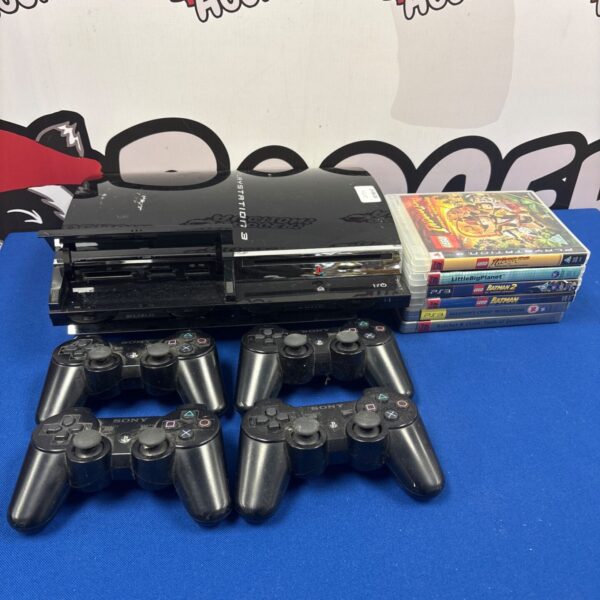Sony PlayStation 3 console bundle with controllers and games.