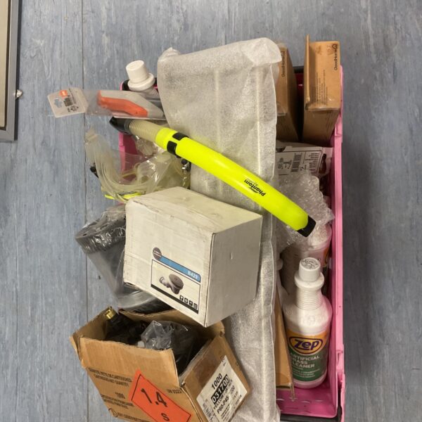 Assorted plumbing connectors and cleaning chemicals in a plastic bin.