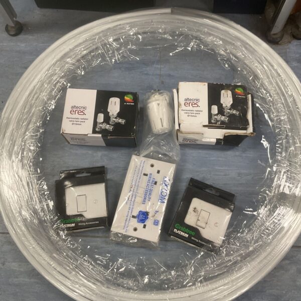 Mixed lot of plumbing and heating components including radiator valves.