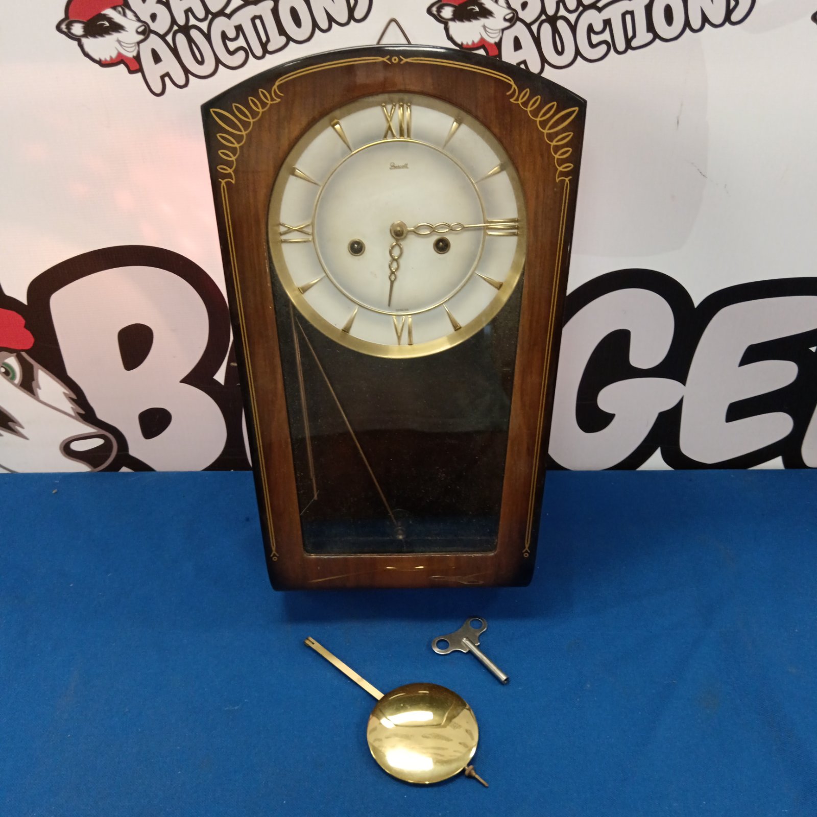 Vintage Prescott wall clock with pendulum and key.