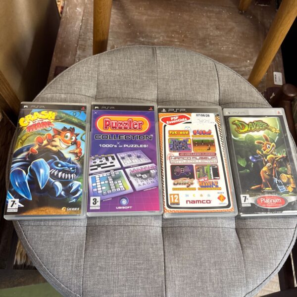 PSP games lot featuring Crash Bandicoot, Daxter, and Puzzle Collection.