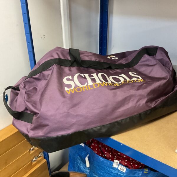 Purple duffle bag with branding, suitable for sports or travel.
