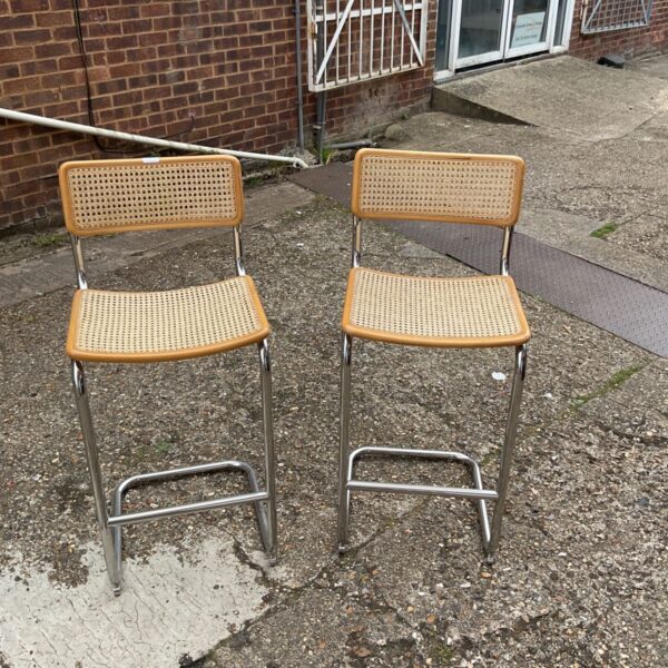 Vintage raffia kitchen stools with chrome frames, a mid-century pair.