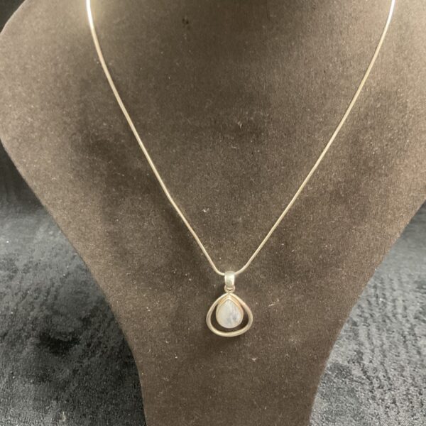 Sterling silver rainbow moonstone pendant necklace on a snakelink chain.