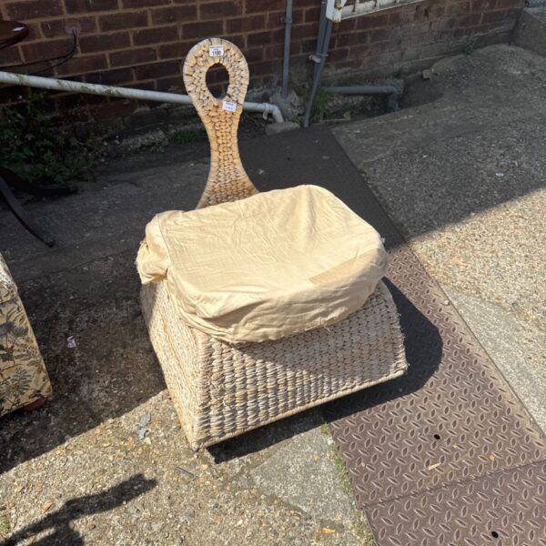 Vintage rattan conservatory chair with woven bull rush detailing.