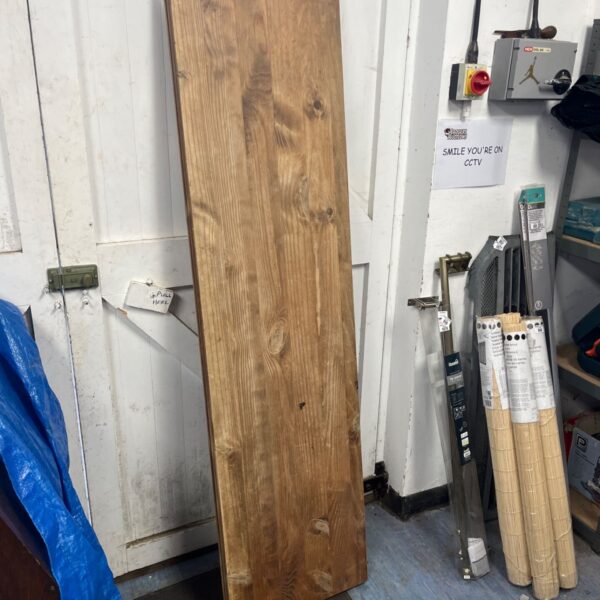 Rustic reclaimed wood table top with industrial character.