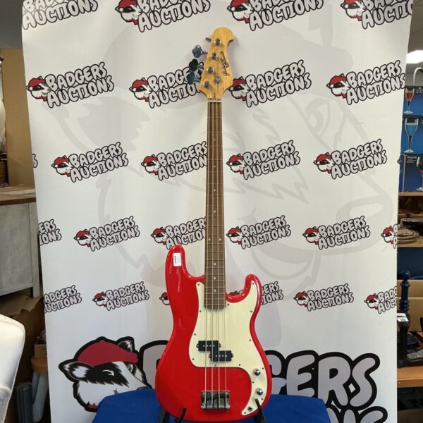 Red Johnny Brook bass guitar, vintage electric instrument.